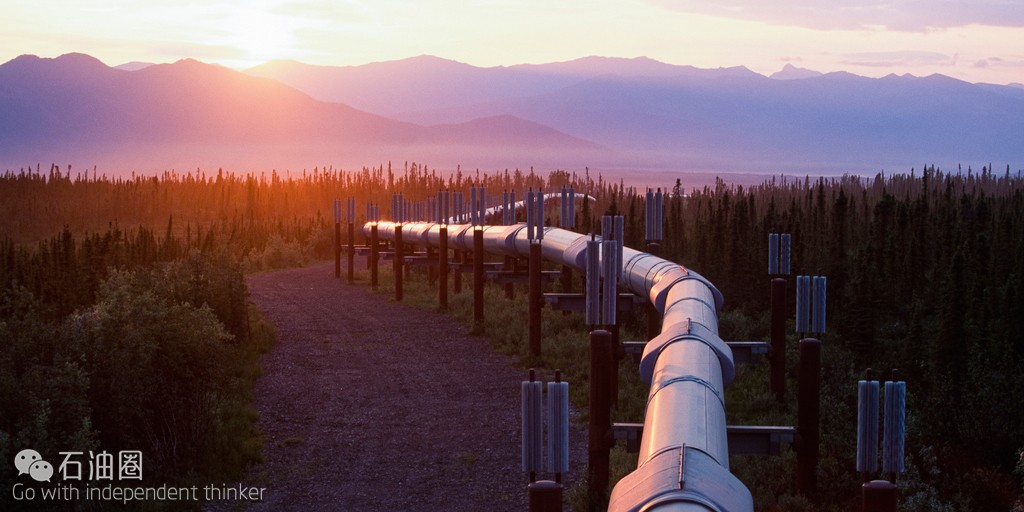 Alaska. Oil Pipeline. Trans-Alaska oil pipeline reflects summer sunset south of Brooks Range.